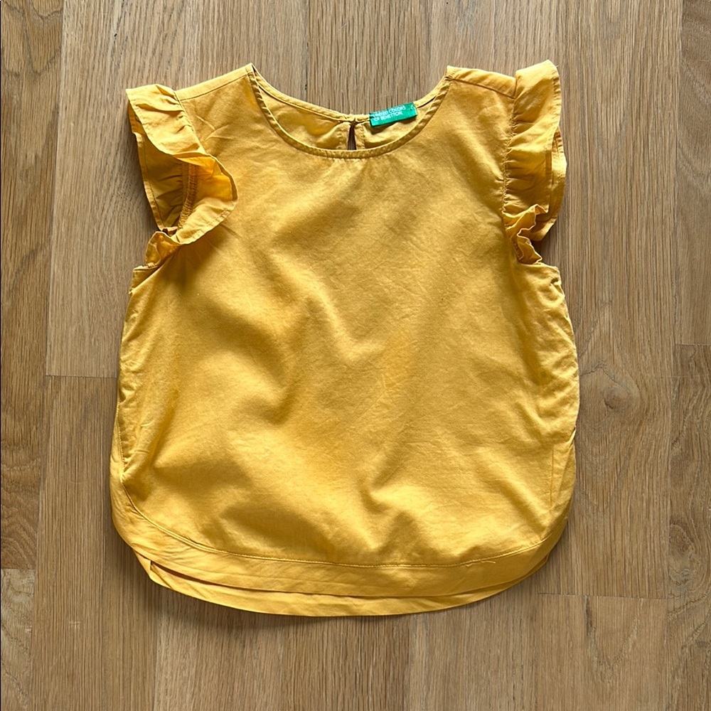 United Colors of Bennetton Cotton Ruffle Sleeve in mustard yellow. Used